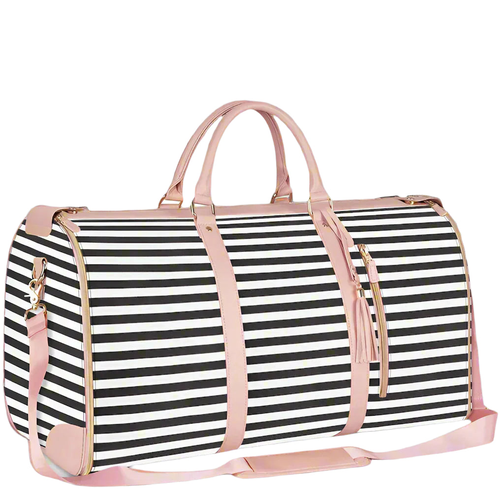 Black and white striped duffel bag with pink straps on a white background